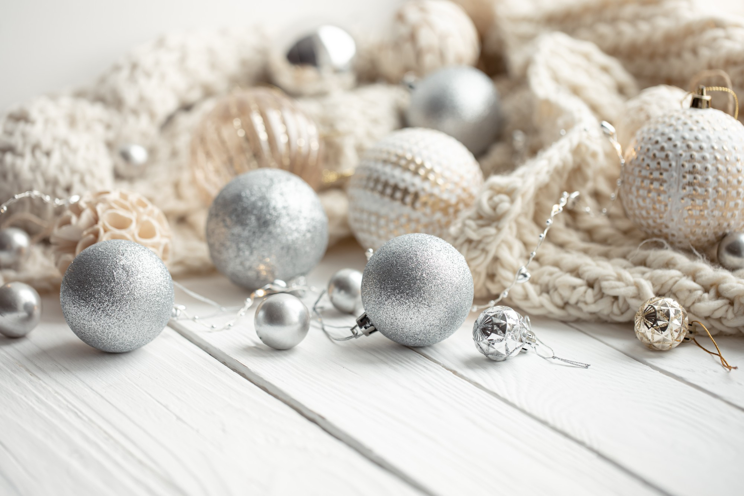 cozy christmas festive background with christmas balls knitted element