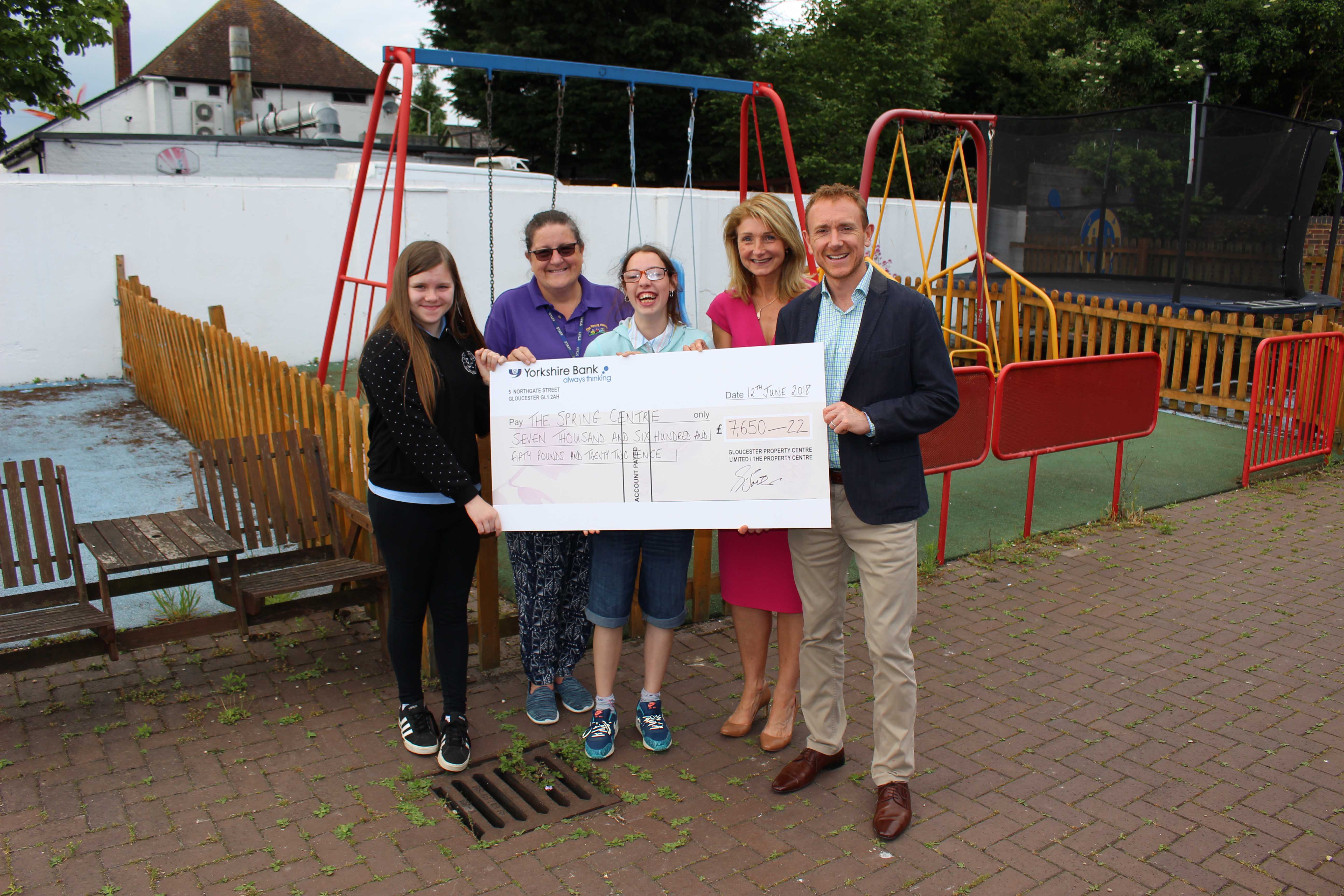 Steve Jones (Partner) and Wendy Worger (Marketing Manager) at The Property Centre presenting a cheque to The Spring Centre after raising money for completing the London Marathon.