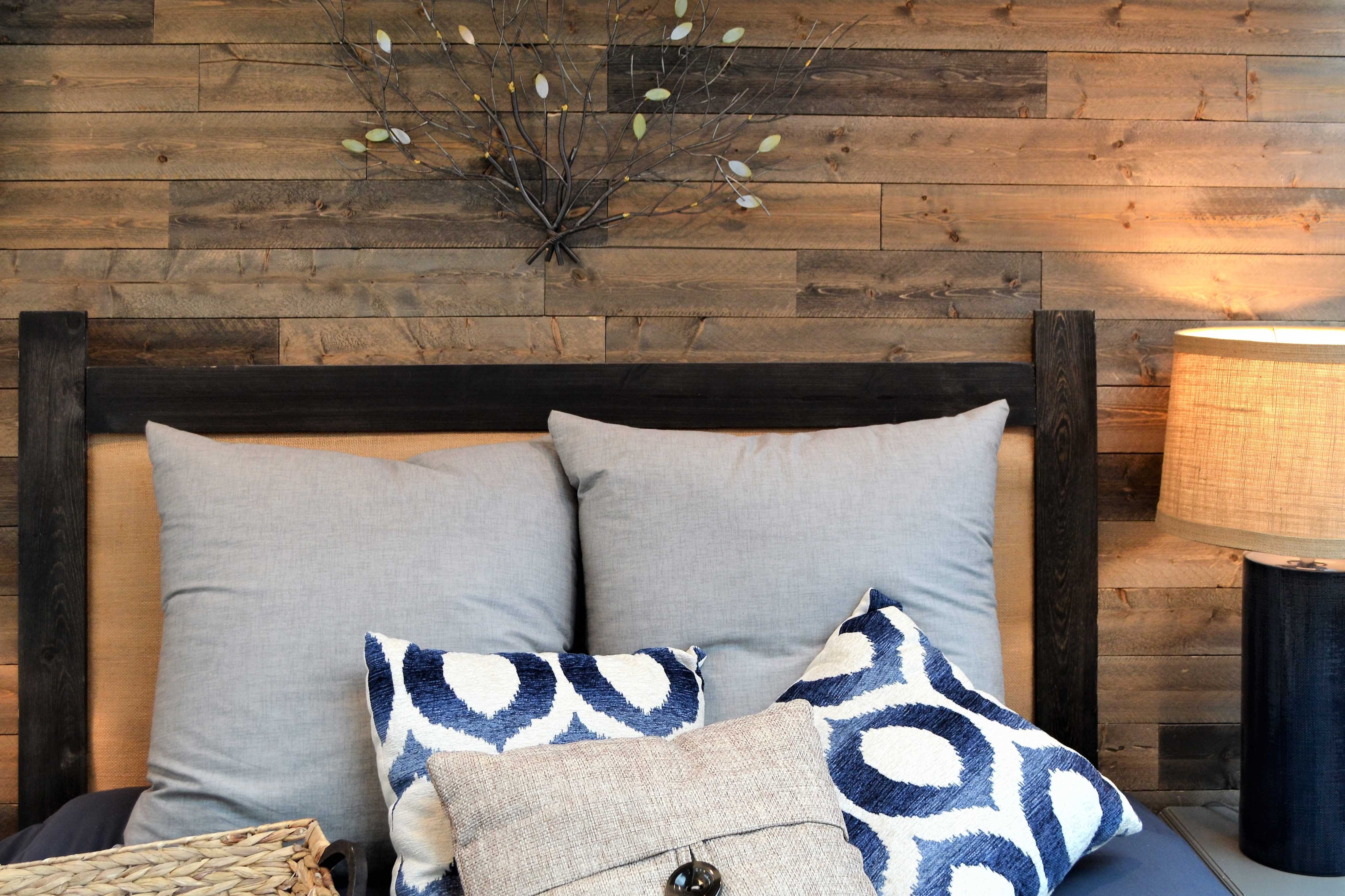 home sweet home bedroom with reclaimed wood wall